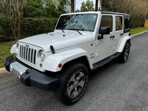 2017 Jeep Wrangler Unlimited for sale at DENMARK AUTO BROKERS in Riviera Beach FL