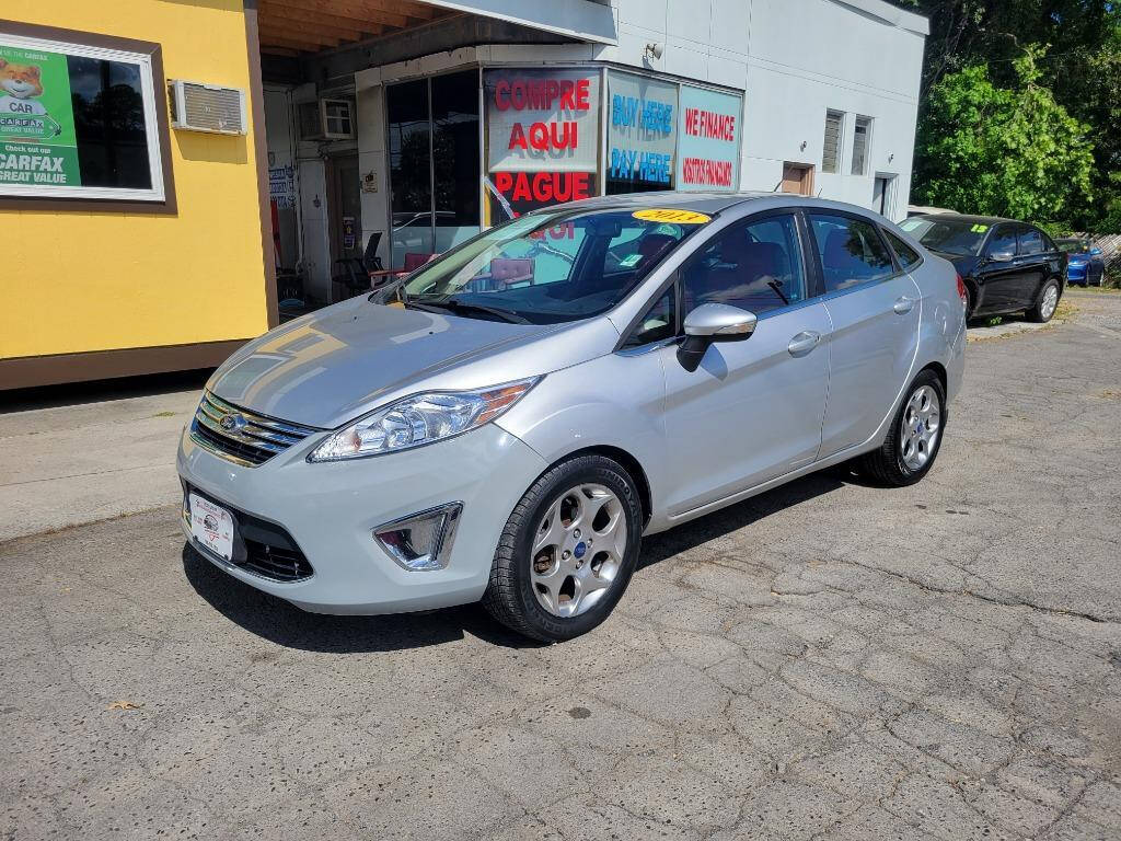 2013 Ford Fiesta for sale at DAGO'S AUTO SALES LLC in Dalton, GA