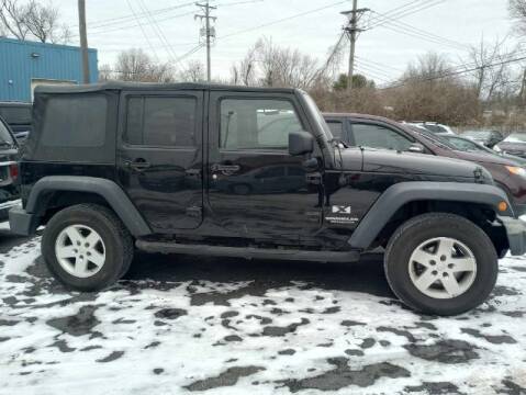 2009 Jeep Wrangler Unlimited for sale at Tri City Auto Mart in Lexington KY