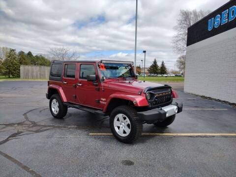2012 Jeep Wrangler Unlimited for sale at Lasco of Grand Blanc in Grand Blanc MI