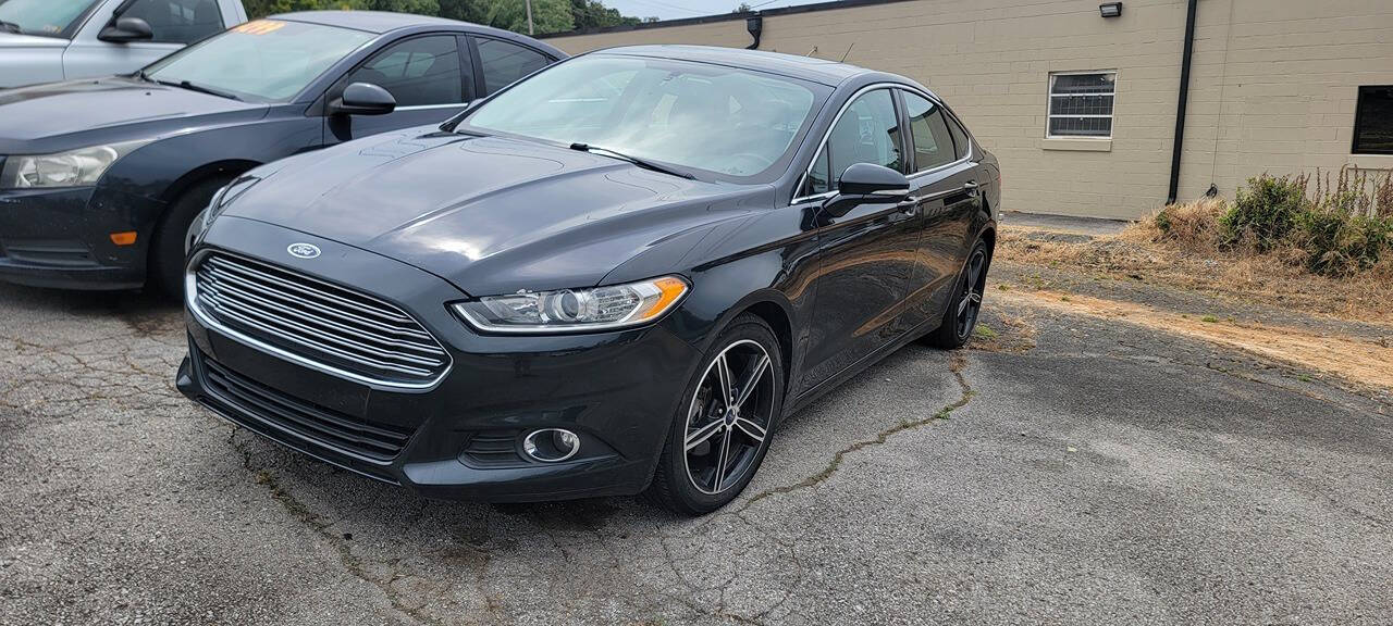 2014 Ford Fusion for sale at Cars For Less in Clarksville, TN