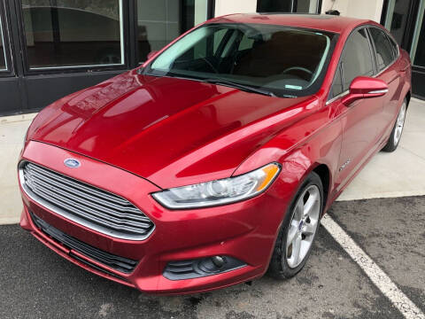 2013 Ford Fusion Hybrid for sale at MAGIC AUTO SALES in Little Ferry NJ