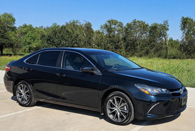 2015 Toyota Camry for sale at CAR MARKET AUTO GROUP in Sugar Land, TX