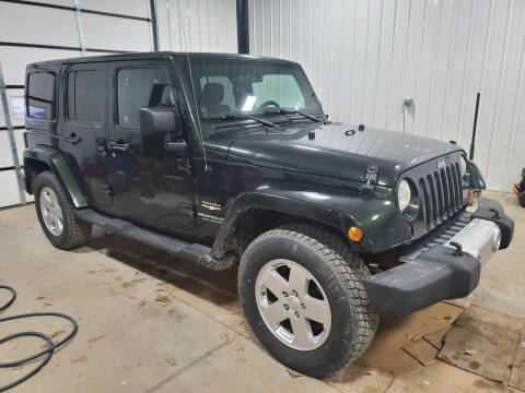 2011 Jeep Wrangler Unlimited for sale at B & T Car Sales LLC in Sand Lake MI