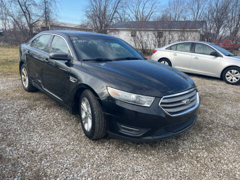 2013 Ford Taurus for sale at HEDGES USED CARS in Carleton MI