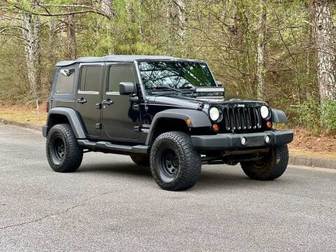 2011 Jeep Wrangler Unlimited for sale at H and S Auto Group in Canton GA