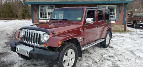 2010 Jeep Wrangler Unlimited for sale at Village Car Company in Hinesburg VT