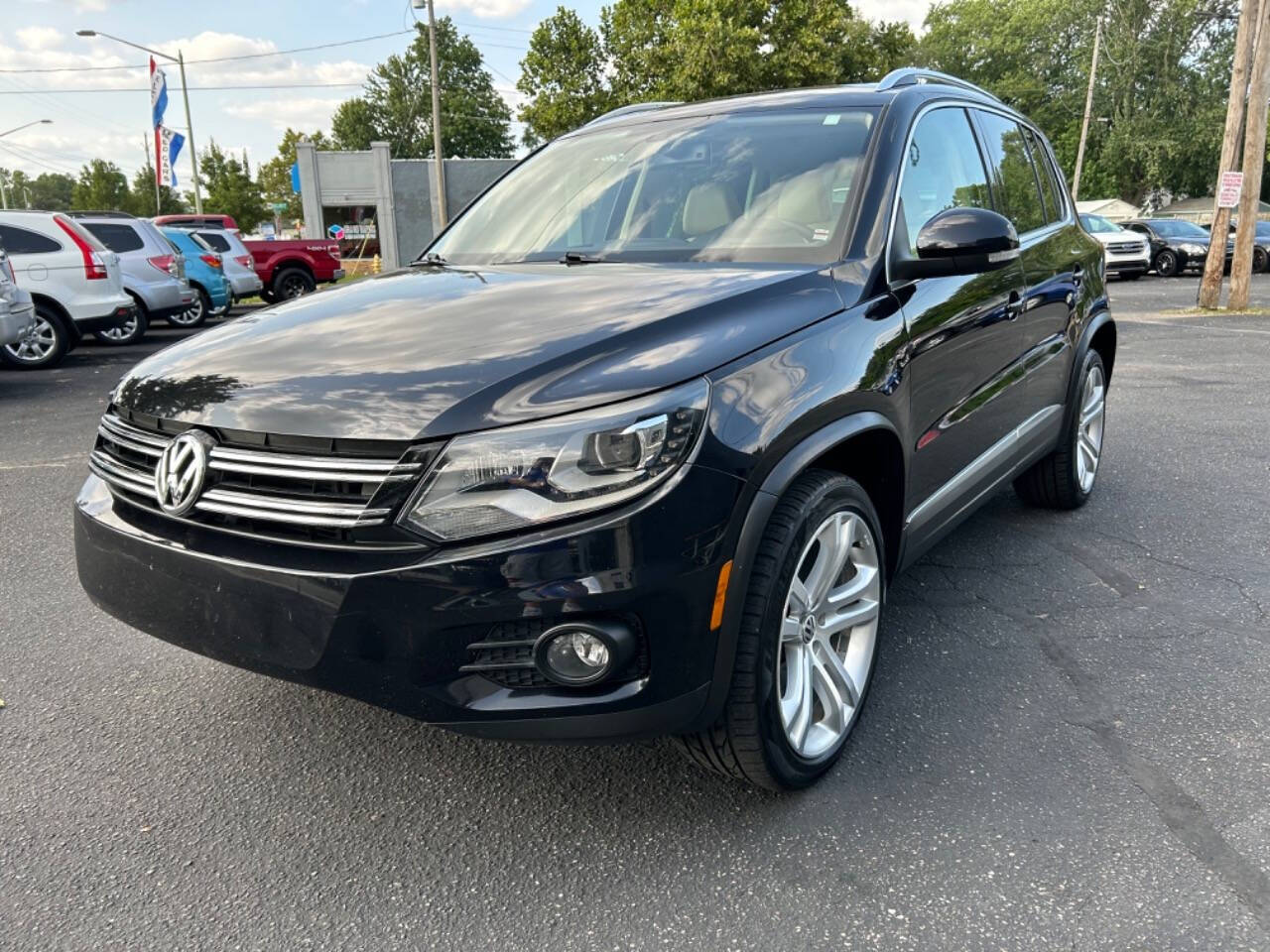 2013 Volkswagen Tiguan for sale at Auto Shop in Wyoming, MI