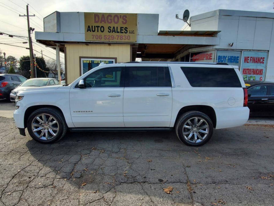 2015 Chevrolet Suburban for sale at DAGO'S AUTO SALES LLC in Dalton, GA