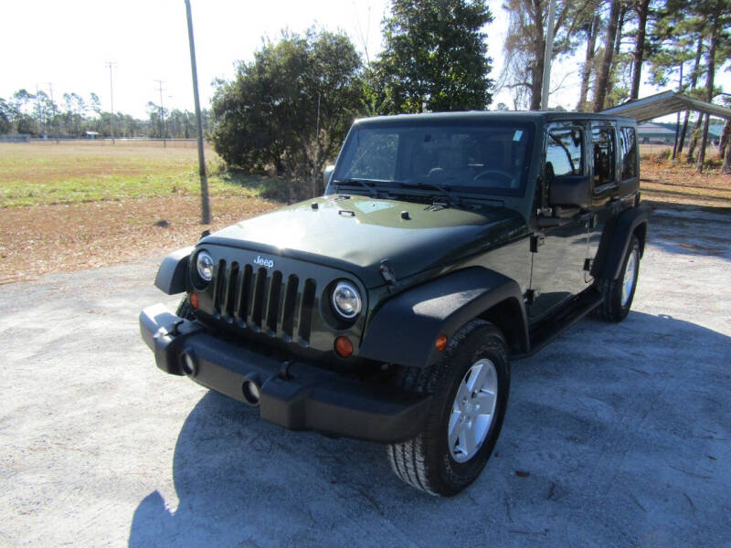 2009 Jeep Wrangler Unlimited for sale at COASTAL AUTO MARKET in Swansboro NC