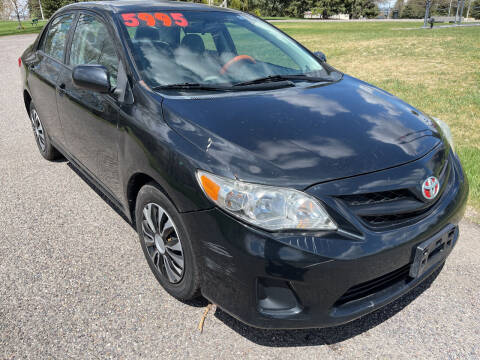 2011 Toyota Corolla for sale at BELOW BOOK AUTO SALES in Idaho Falls ID