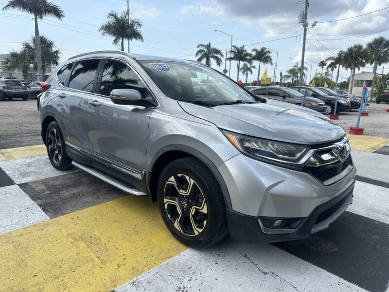Used 2017 Honda CR-V Touring with VIN 5J6RW1H99HL008259 for sale in Melbourne, FL