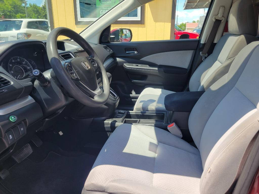 2016 Honda CR-V for sale at DAGO'S AUTO SALES LLC in Dalton, GA