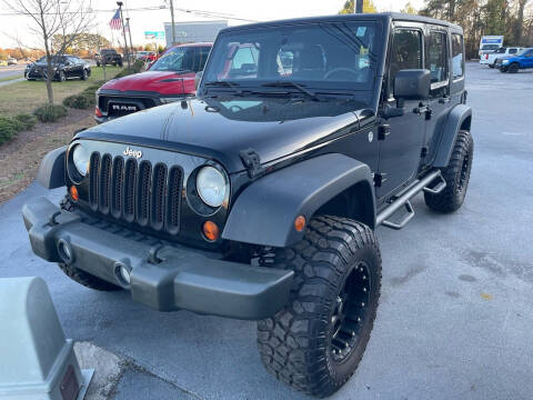 2013 Jeep Wrangler Unlimited for sale at Greenville Motor Company in Greenville NC