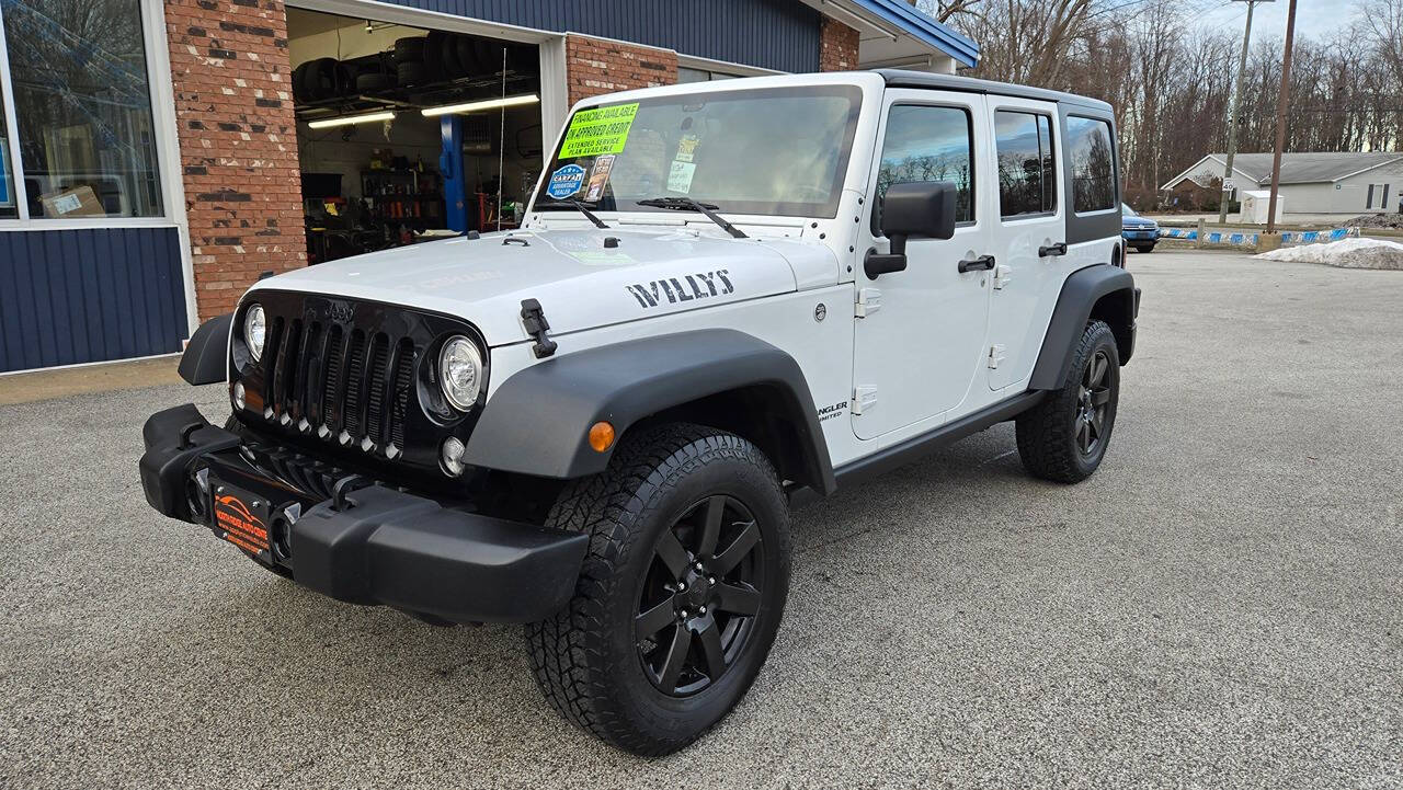 2017 Jeep Wrangler Unlimited for sale at North Ridge Auto Center LLC in Madison, OH