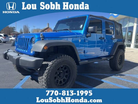 2016 Jeep Wrangler Unlimited for sale at Lou Sobh Honda in Cumming GA