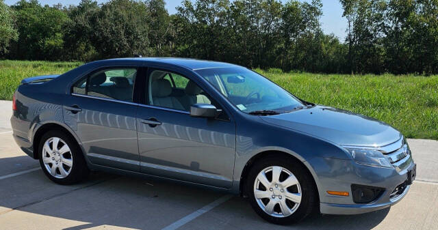 2011 Ford Fusion for sale at CAR MARKET AUTO GROUP in Sugar Land, TX