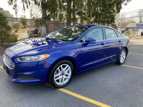 2014 Ford Fusion for sale at AMERI-CAR & TRUCK SALES INC in Haskell NJ