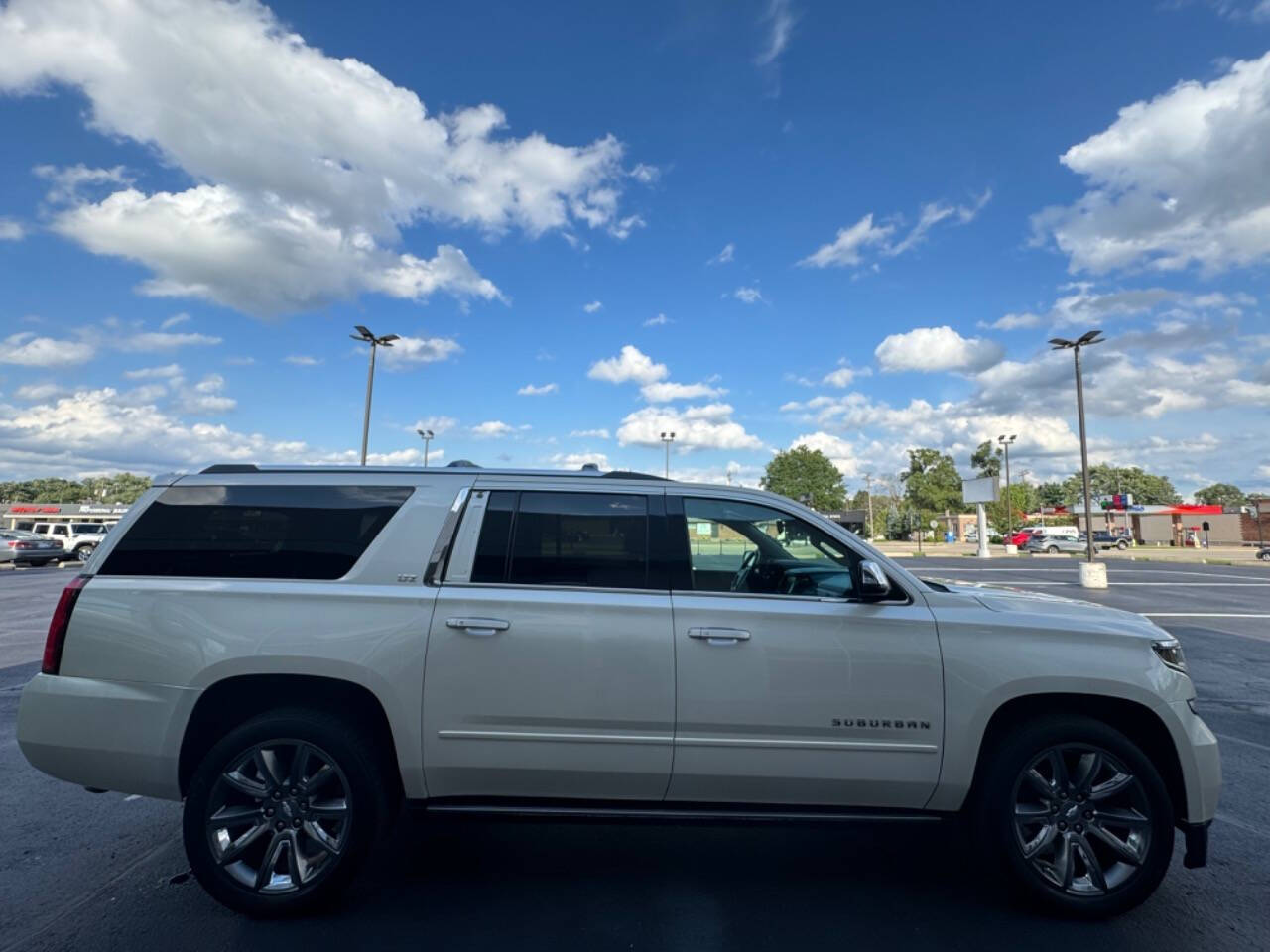 2015 Chevrolet Suburban for sale at Opus Motorcars in Utica, MI