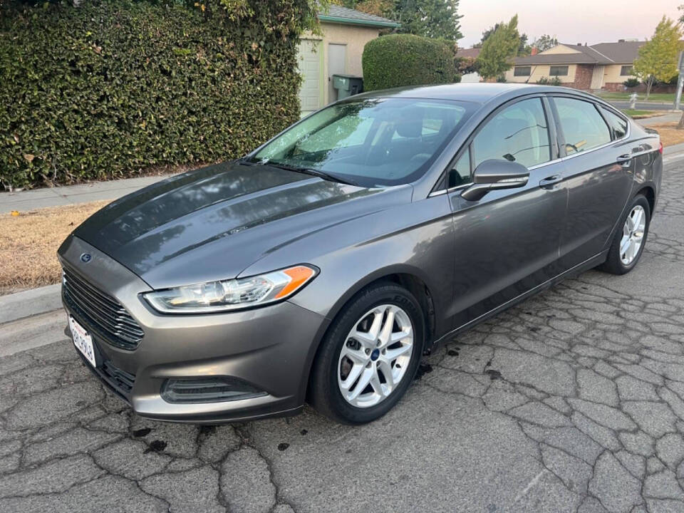 2014 Ford Fusion for sale at AUTO 4 LESS in Fresno, CA