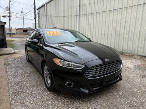 2015 Ford Fusion Hybrid for sale at CHEAPIE AUTO SALES INC in Metairie LA