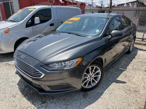 2017 Ford Fusion Hybrid for sale at CHEAPIE AUTO SALES INC in Metairie LA