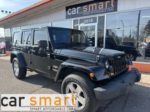 2012 Jeep Wrangler Unlimited for sale at Car Smart in Wausau WI