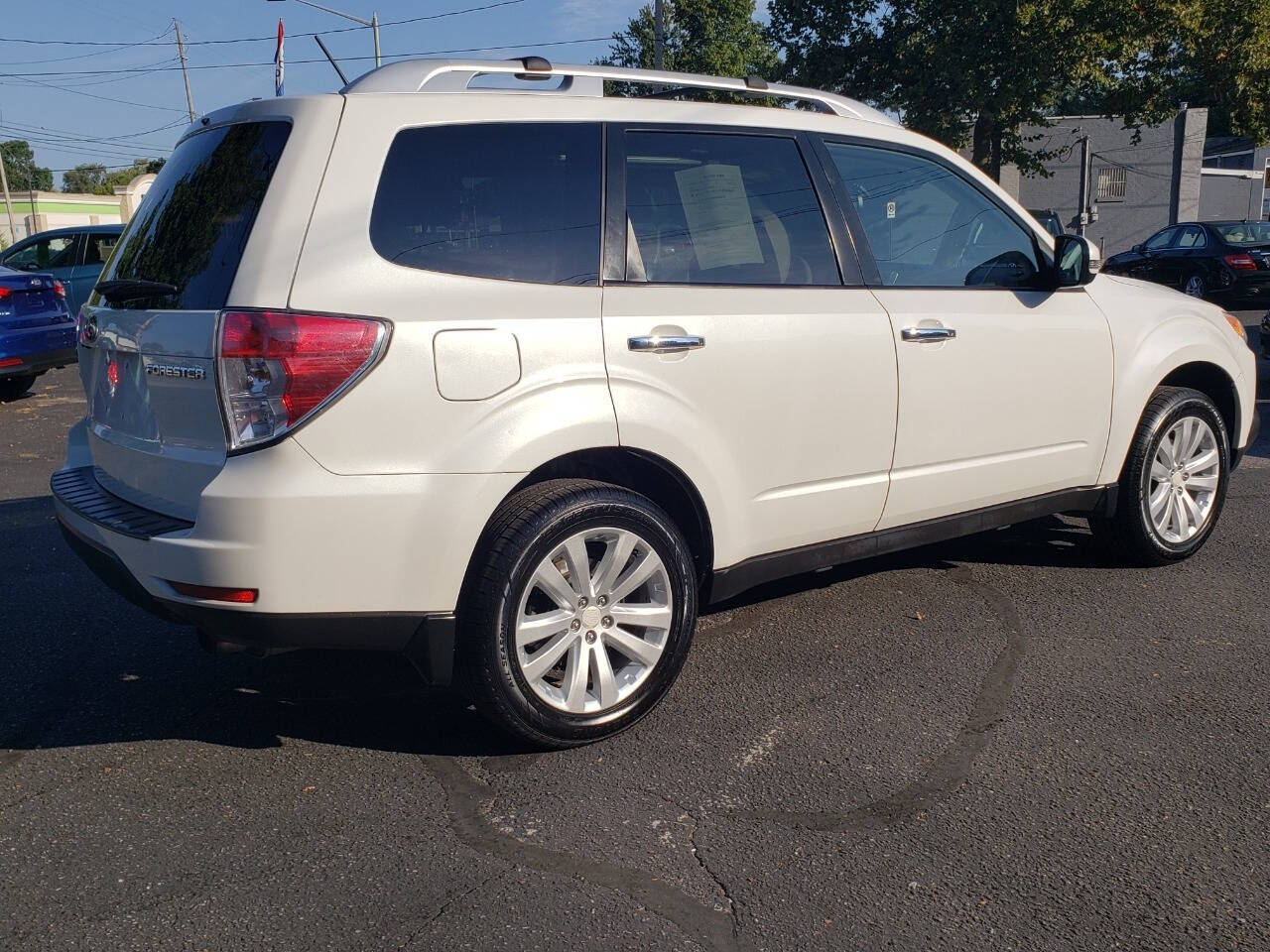 2011 Subaru Forester for sale at Auto Shop in Wyoming, MI