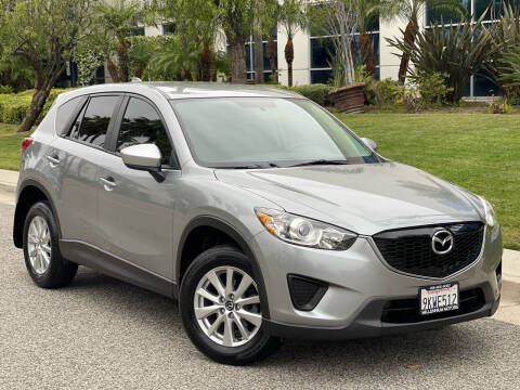 2015 Mazda CX-5 for sale at MILLENNIUM MOTORS in Van Nuys CA