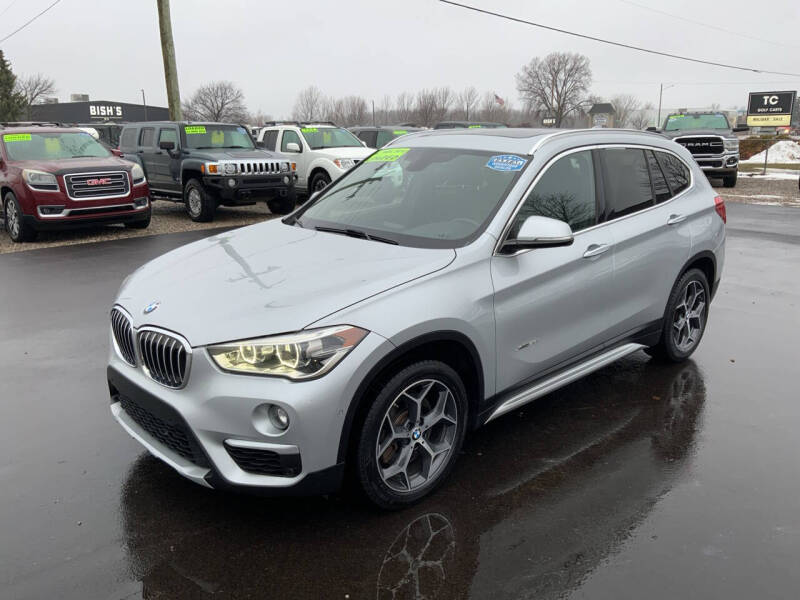 Used 2016 BMW X1 28i with VIN WBXHT3C32GP887204 for sale in Traverse City, MI