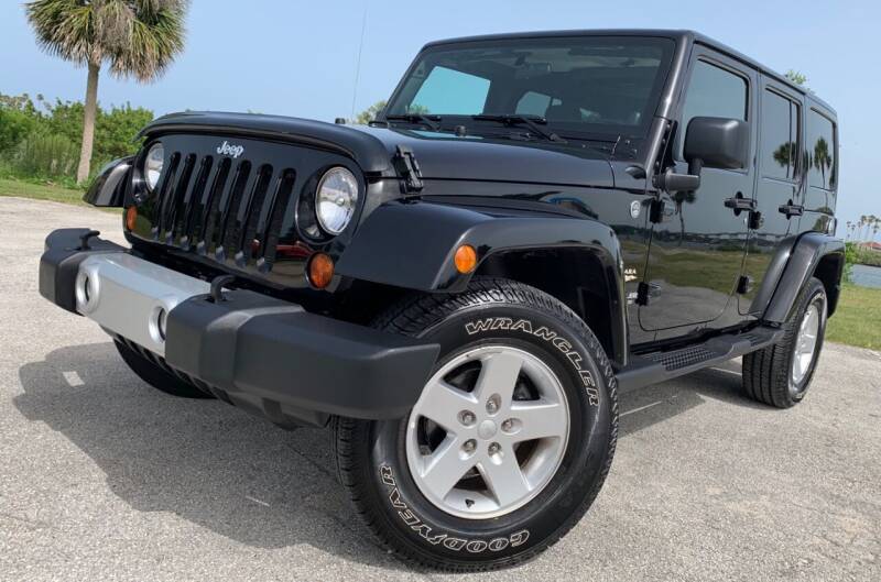 2011 Jeep Wrangler Unlimited for sale at PennSpeed in New Smyrna Beach FL