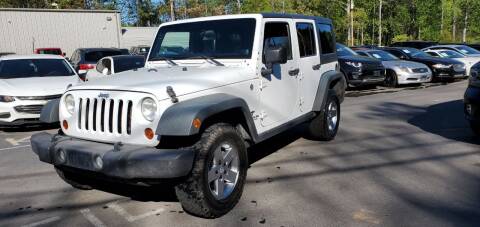 2012 Jeep Wrangler Unlimited for sale at GEORGIA AUTO DEALER LLC in Buford GA