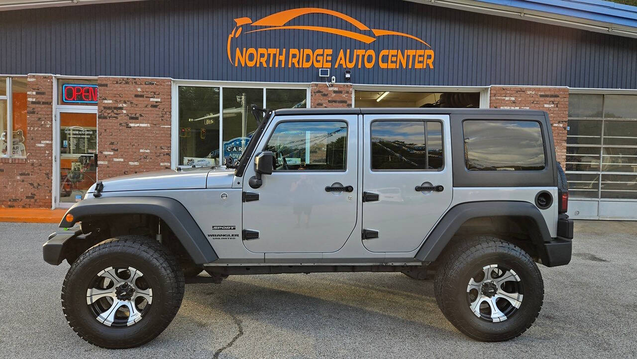 2014 Jeep Wrangler Unlimited for sale at North Ridge Auto Center LLC in Madison, OH