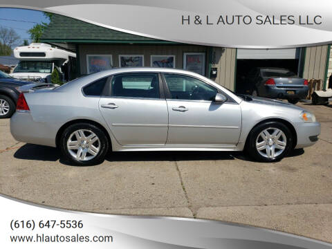 2011 Chevrolet Impala for sale at H & L AUTO SALES LLC in Wyoming MI