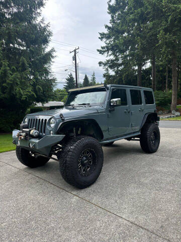 2015 Jeep Wrangler Unlimited for sale at DC MOTORS LLC in Auburn WA