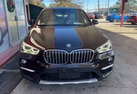 2017 BMW X1 for sale at THE CAR MANN in Stone Mountain GA