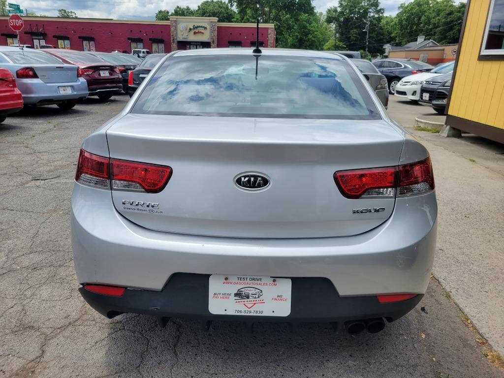 2010 Kia Forte Koup for sale at DAGO'S AUTO SALES LLC in Dalton, GA