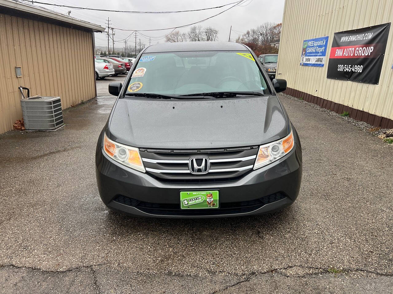 2013 Honda Odyssey for sale at BNM AUTO GROUP in GIRARD, OH