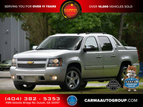 2013 Chevrolet Avalanche for sale at Carma Auto Group in Duluth GA