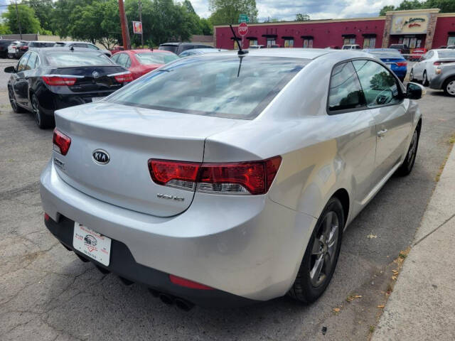 2010 Kia Forte Koup for sale at DAGO'S AUTO SALES LLC in Dalton, GA