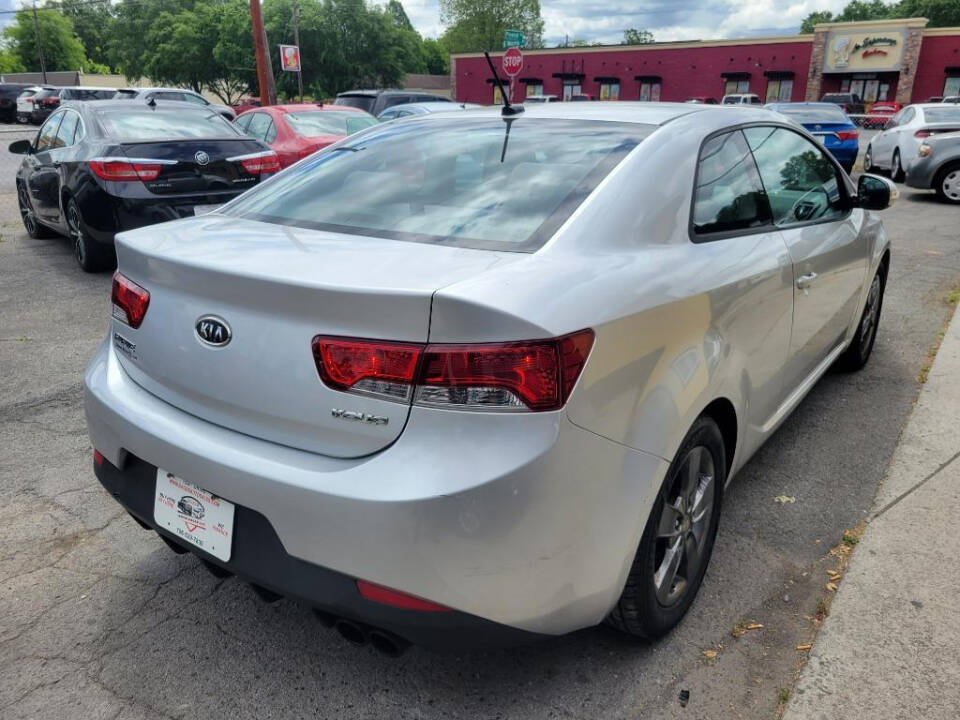 2010 Kia Forte Koup for sale at DAGO'S AUTO SALES LLC in Dalton, GA