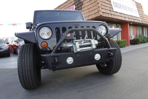 2012 Jeep Wrangler Unlimited for sale at CARSTER in Huntington Beach CA