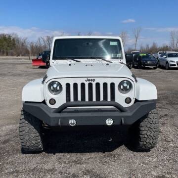 2015 Jeep Wrangler Unlimited for sale at Heely's Autos in Lexington MI