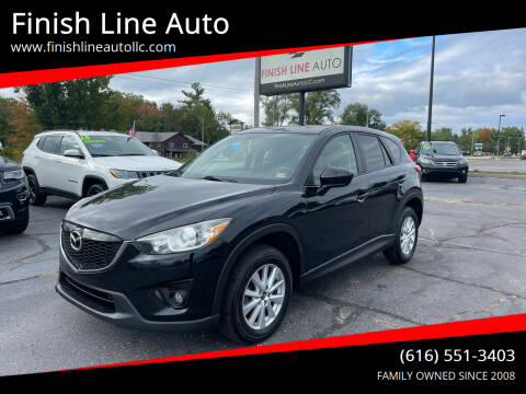 2014 Mazda CX-5 for sale at Finish Line Auto in Comstock Park MI