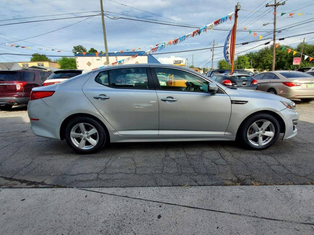 2014 Kia Optima for sale at DAGO'S AUTO SALES LLC in Dalton, GA