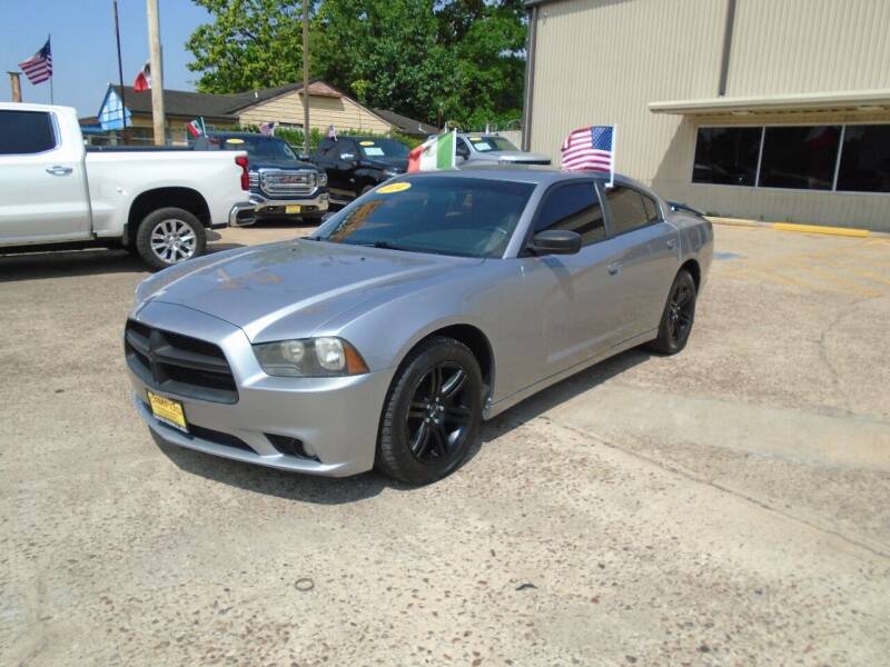 2014 Dodge Charger for sale at Campos Trucks & SUVs, Inc. in Houston TX