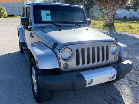 2014 Jeep Wrangler Unlimited for sale at Consumer Auto Credit in Tampa FL
