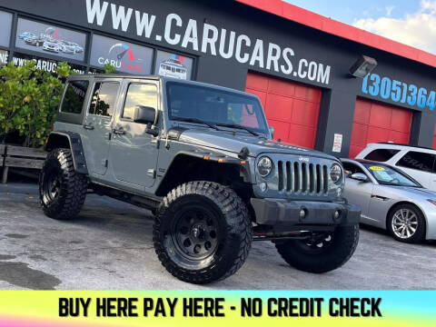 2015 Jeep Wrangler Unlimited for sale at CARUCARS LLC in Miami FL