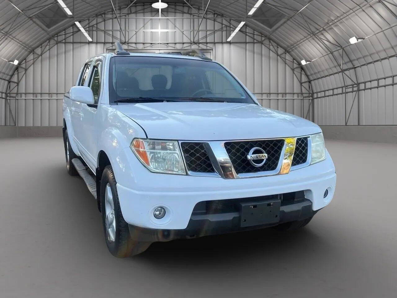 2008 Nissan Frontier SE V6 4x4 4dr Crew Cab 5.0 ft. SB Pickup 5A's photo