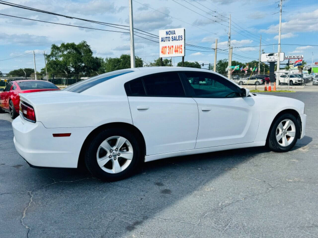 2014 Dodge Charger for sale at NOVA AUTO SALES in Orlando, FL